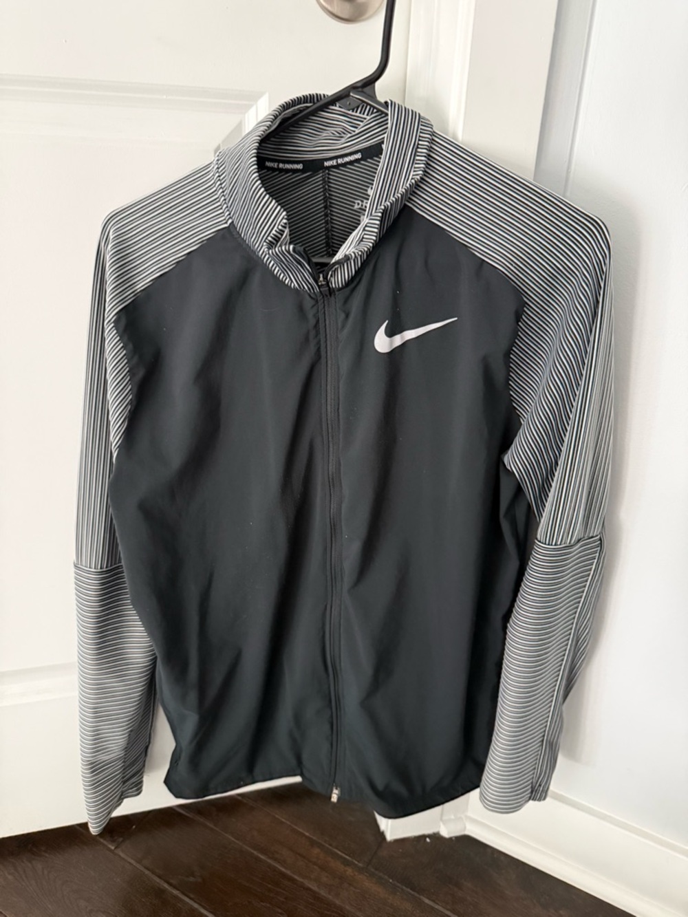 Nike Men’s Black Jacket with White Striped Sleeves